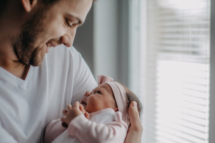 Father holds baby